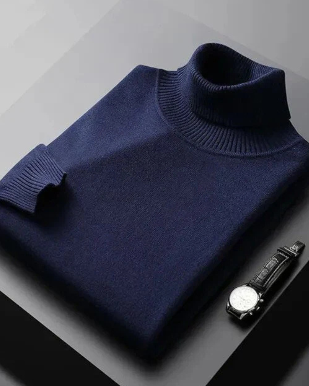 Jersey azul marino de punto con cuello alto, tejido liso y puños acanalados