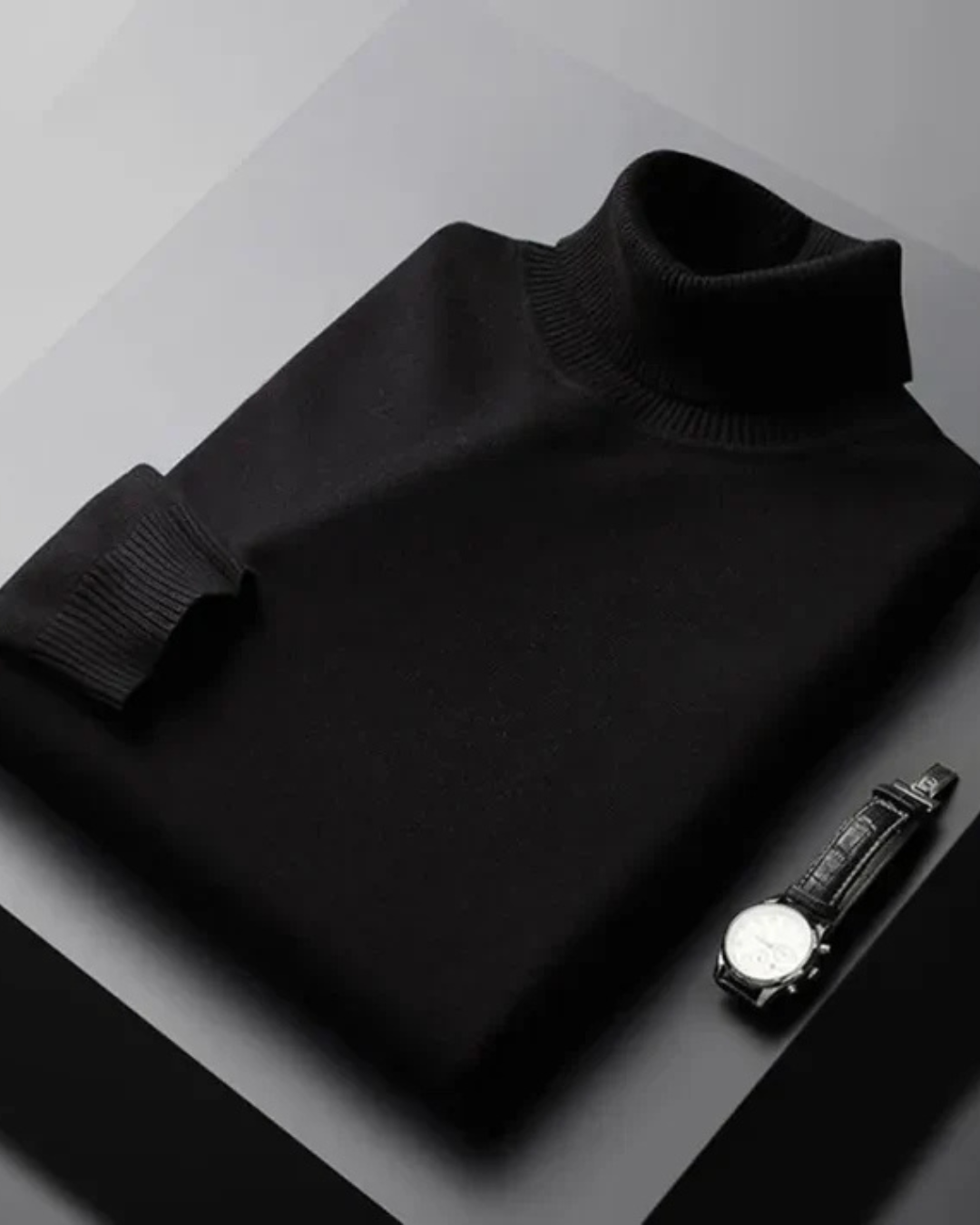 Jersey negro de punto con cuello alto acanalado y manga larga, tejido liso