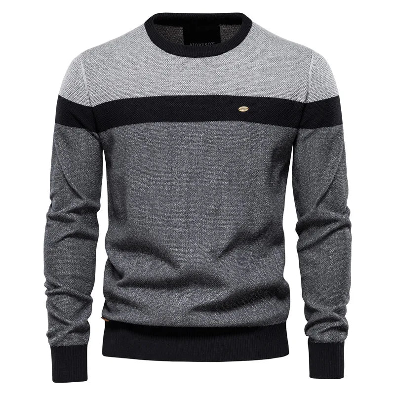 Jersey de punto bicolor gris y negro, cuello redondo, manga larga