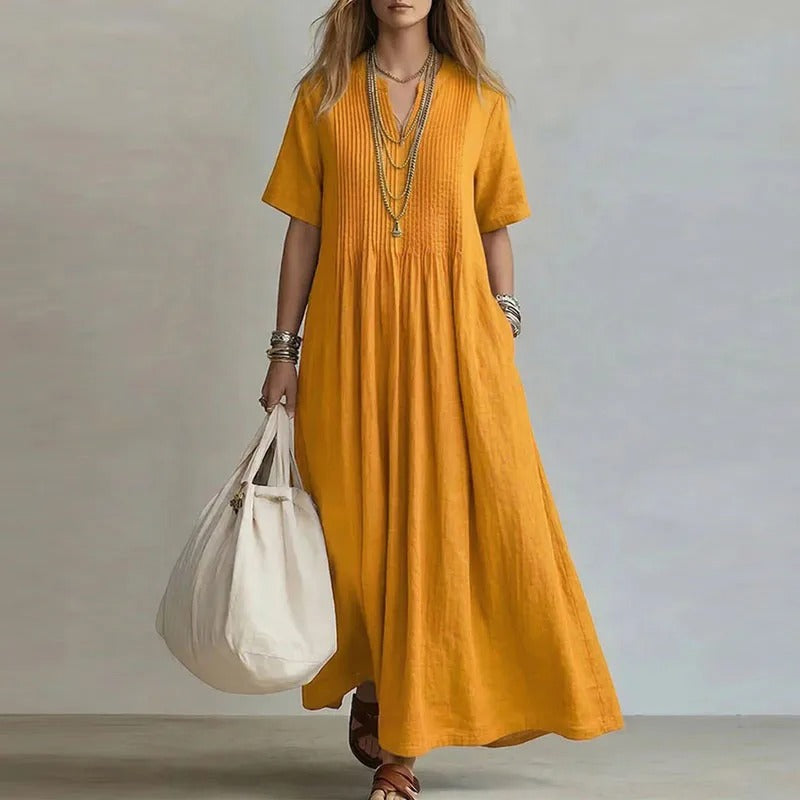 Vestido largo amarillo mostaza con manga corta y fruncido central