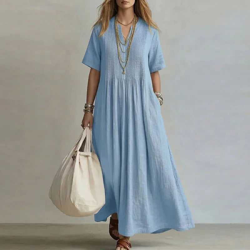 Vestido largo celeste con manga corta y fruncido en el pecho